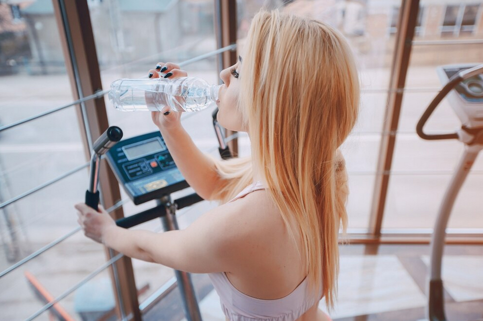 Fitness Enthusiast Drinking Hydrogen Water